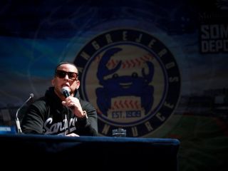 Daddy Yankee speaks at press conference on stage